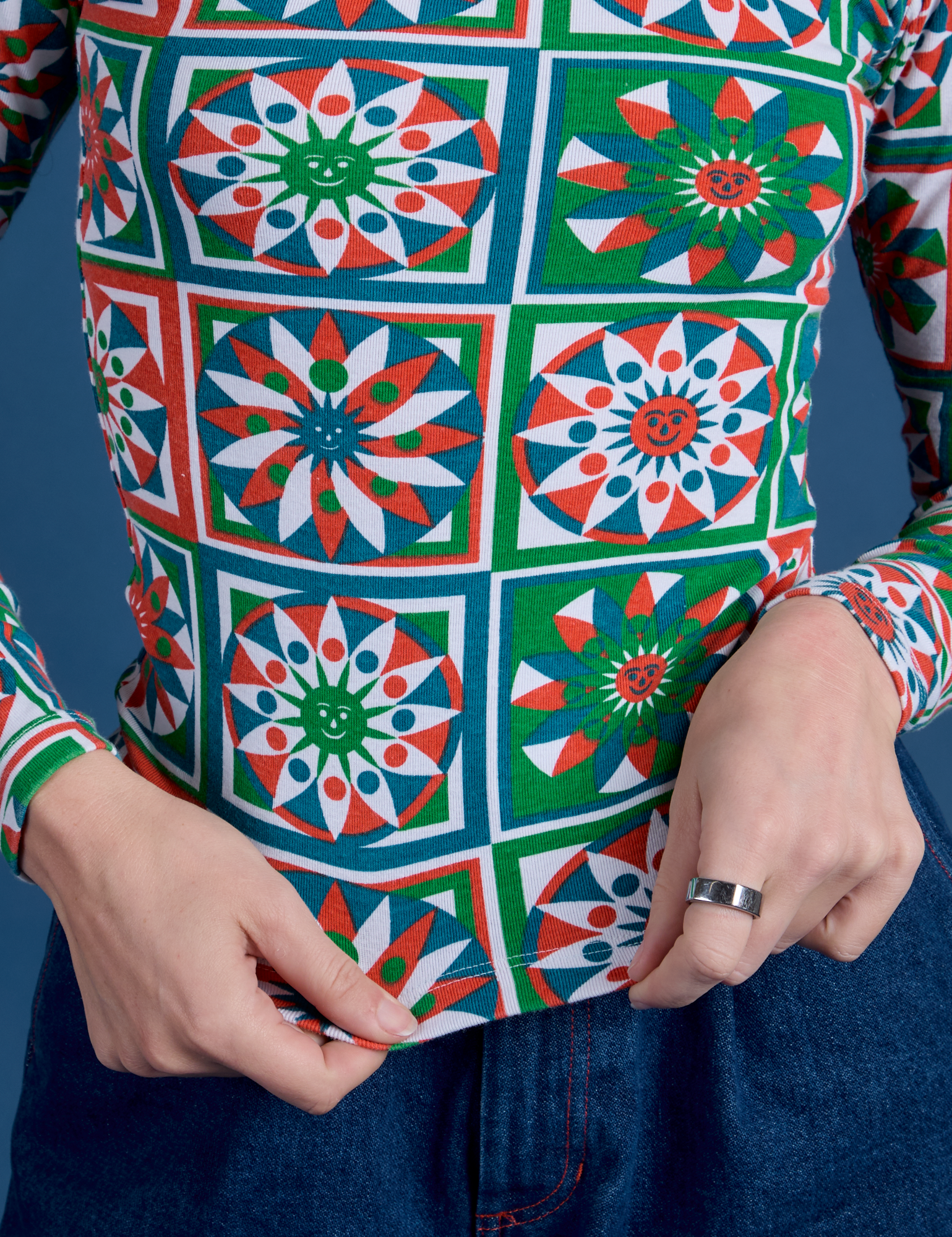 Long Sleeve Baby Tee in Quilt Print close up on Alex