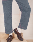 Pant leg close up of Railroad Stripe Denim Original Overalls worn by Jesse