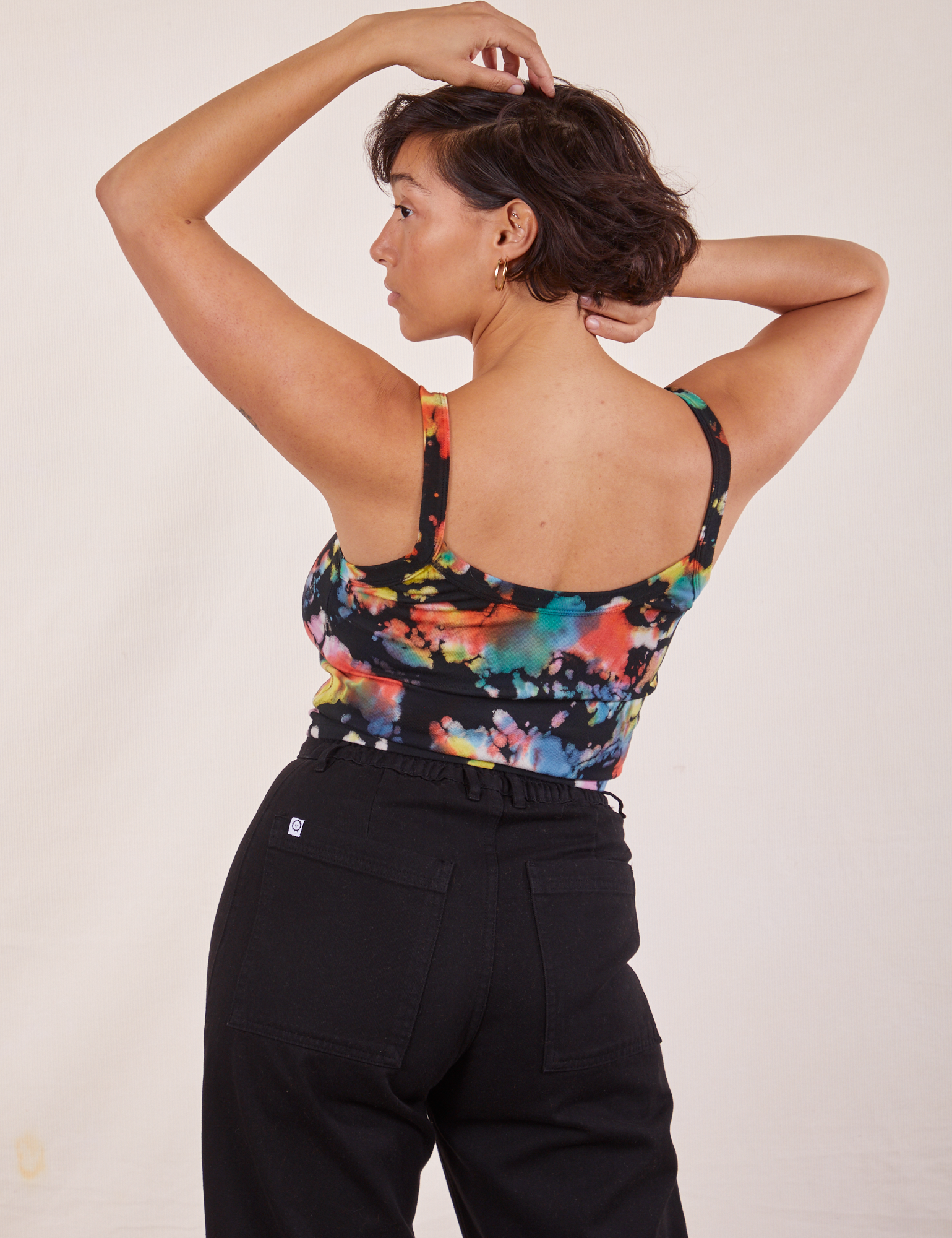 Back view of Cropped Cami in Rainbow Magic Waters and black Western Pants worn by Tiara