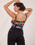 Back view of Cropped Cami in Rainbow Magic Waters and black Western Pants worn by Tiara