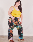 Angled front view of Western Pants in Rainbow Magic Waters and sunshine yellow Cami on Ashley