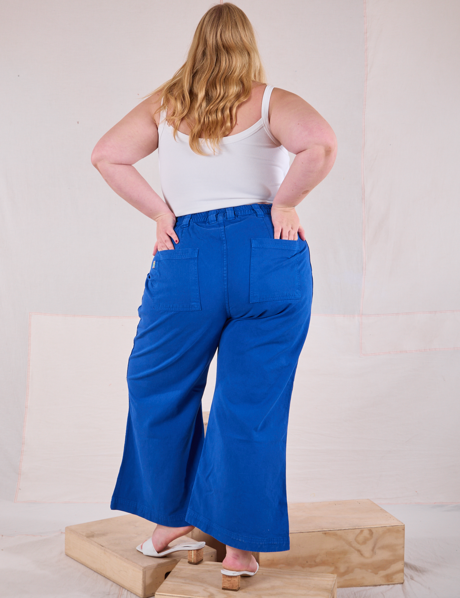 Back view of Bell Bottoms in Royal Blue and Cami in Vintage Tee Off-White on Juliet