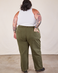 Back view of Work Pants in Surplus Green and Cropped Tank in vintage tee off-white on Sam