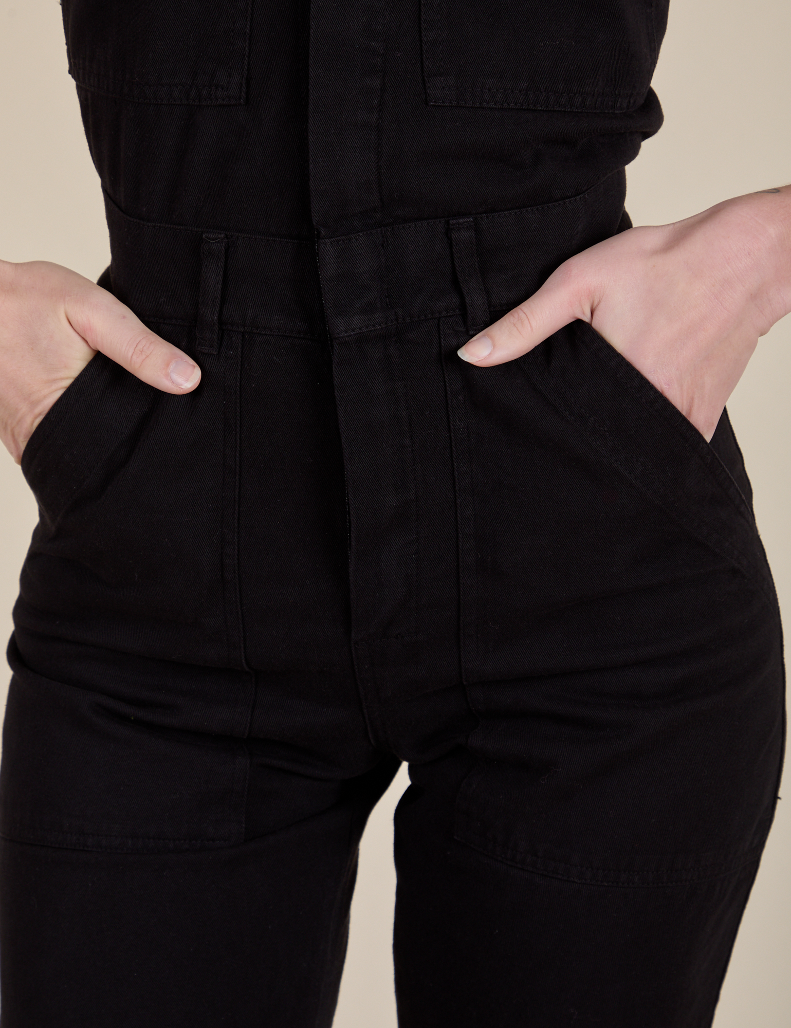 Short Sleeve Jumpsuit in Basic Black close up on Alex