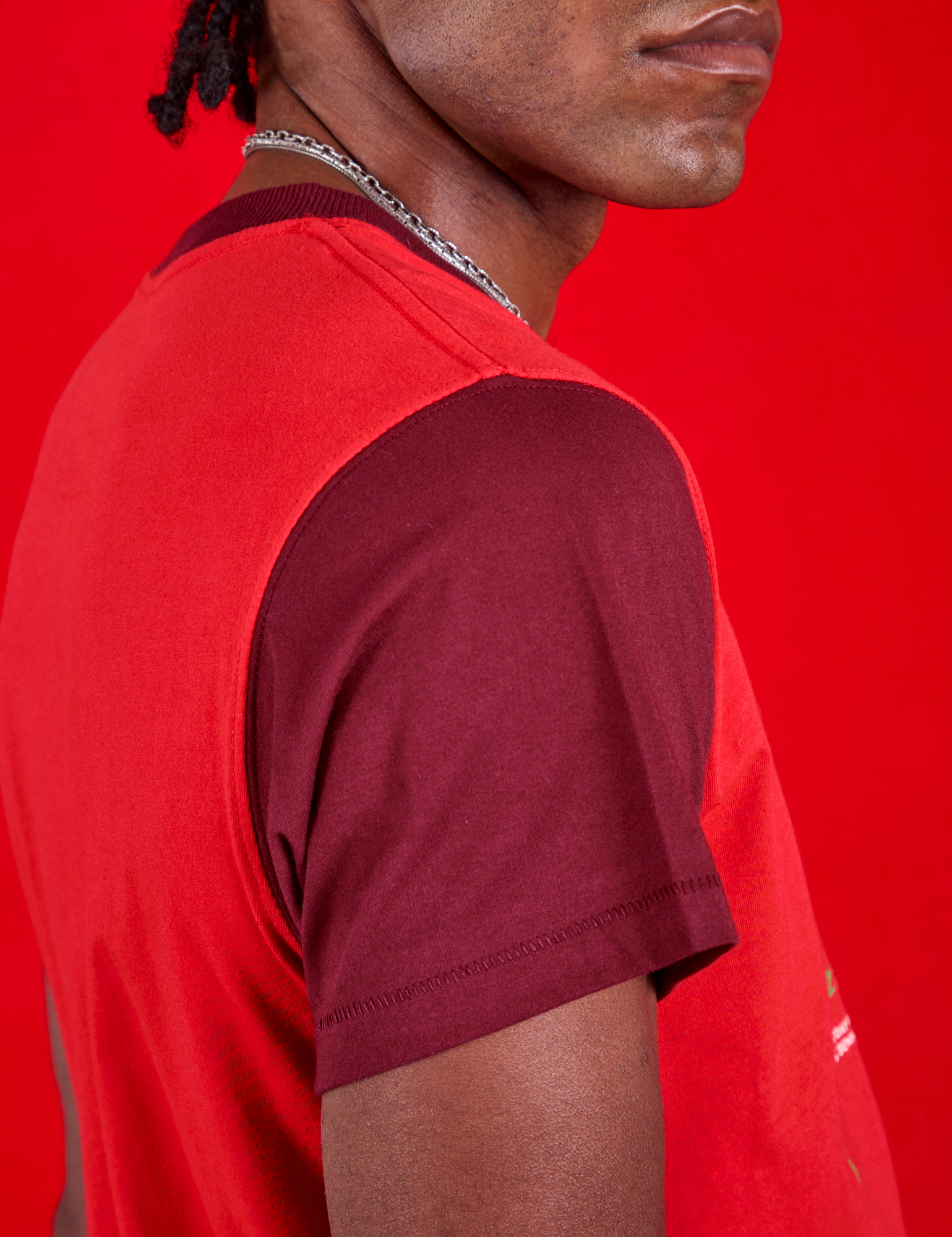 Vintage Tee in Cherry Soda side close up of red wine contrast sleeve on Jerrod