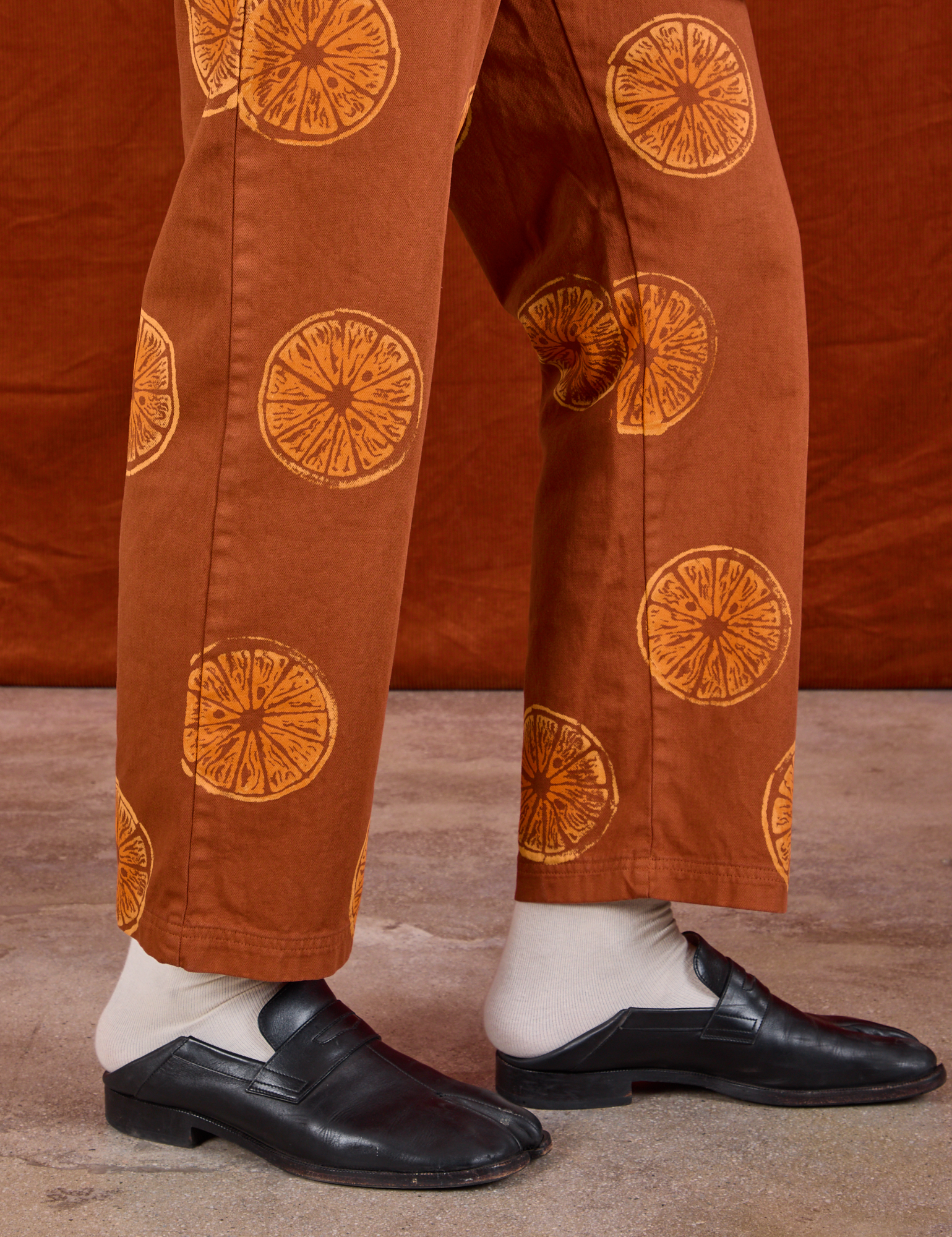 Paintstamped Work Pants in Orange side view on Jerrod