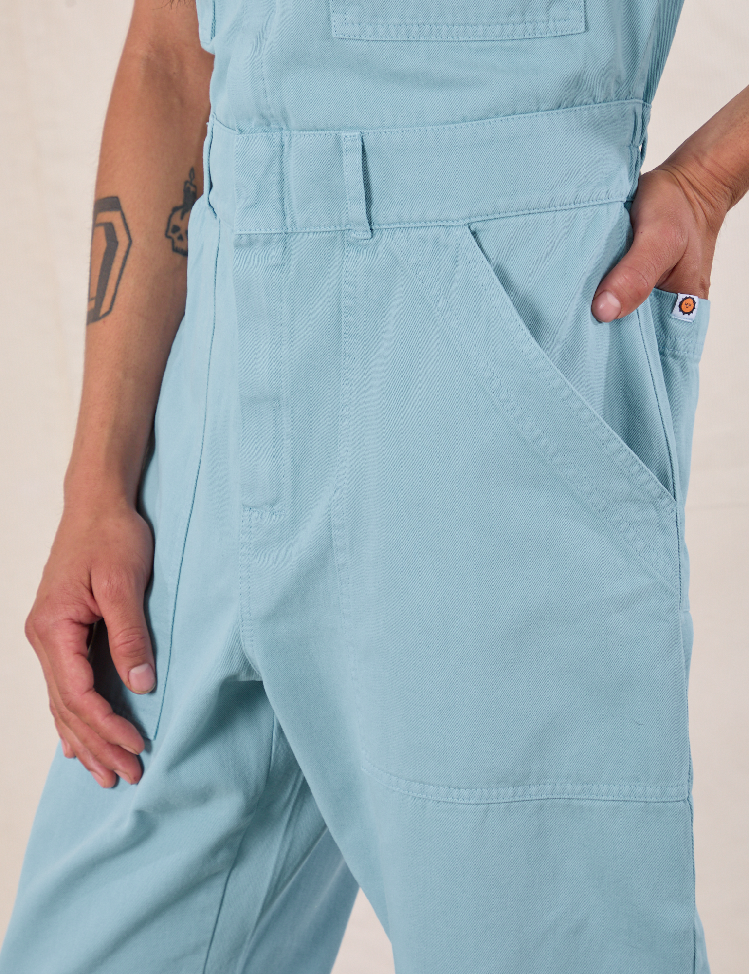 Short Sleeve Jumpsuit in Baby Blue side close up on Anthony