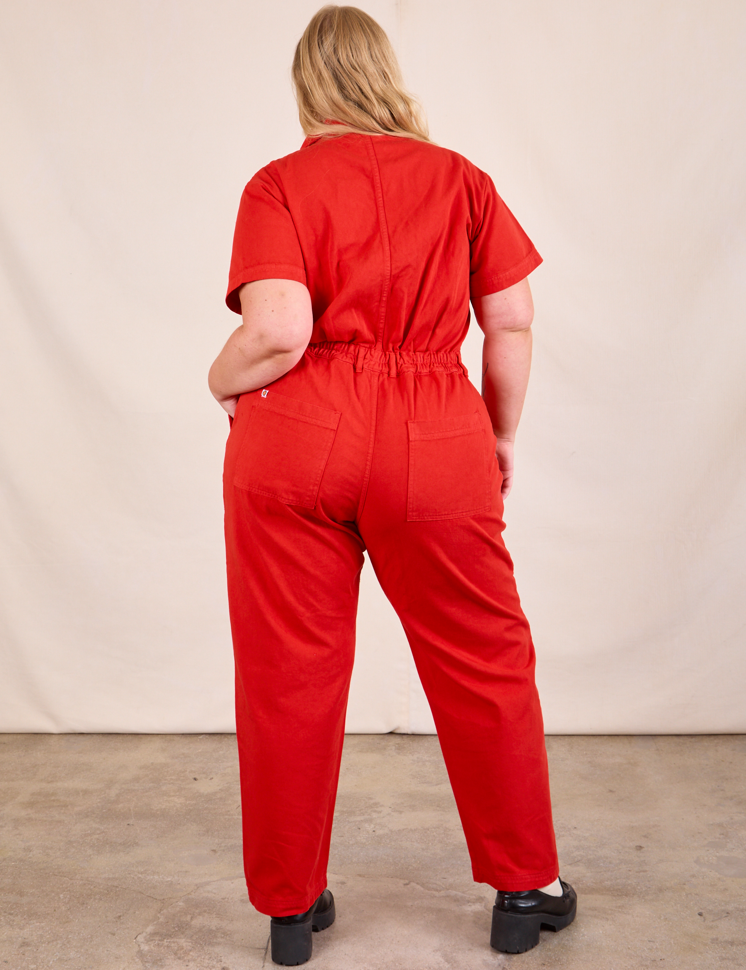 Short Sleeve Jumpsuit in Mustang Red back view on Juliet