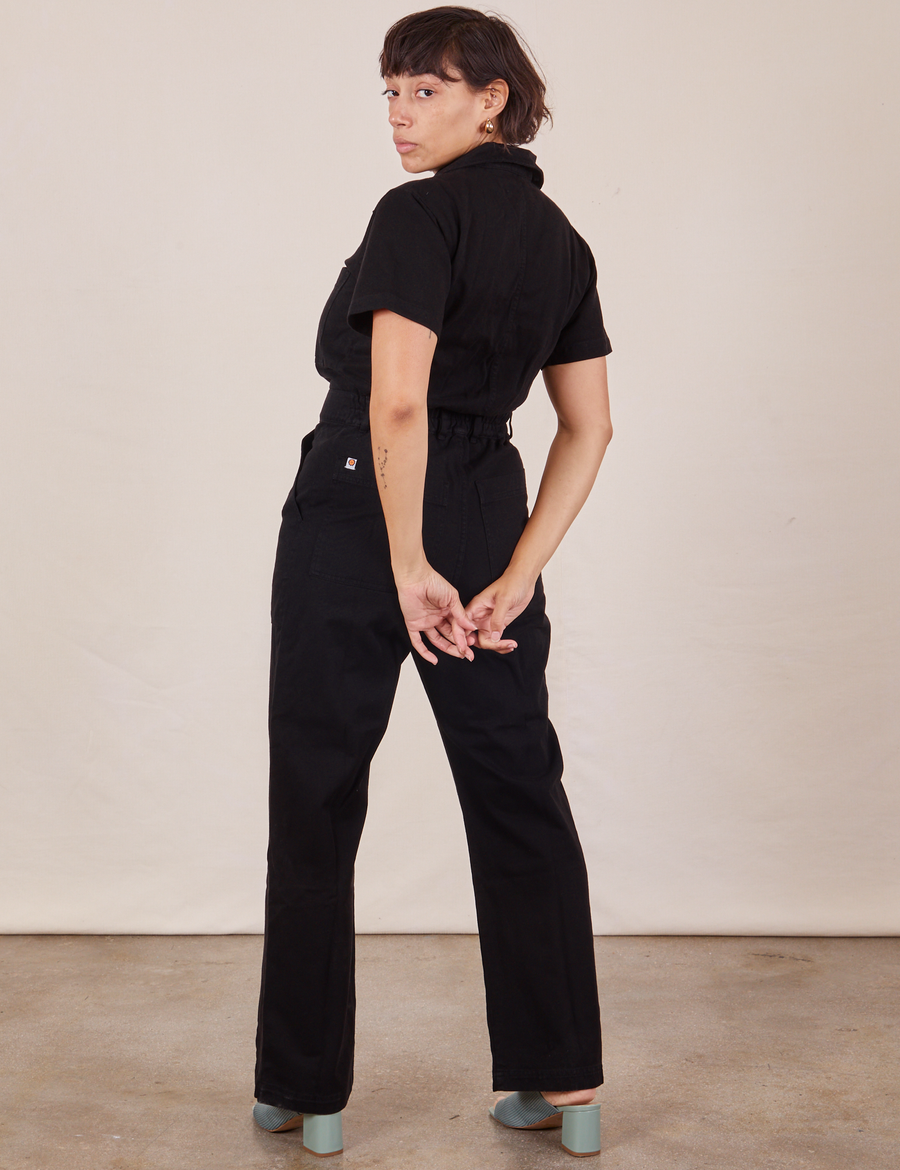 Back view of Short Sleeve Jumpsuit in Basic Black worn by Tiara