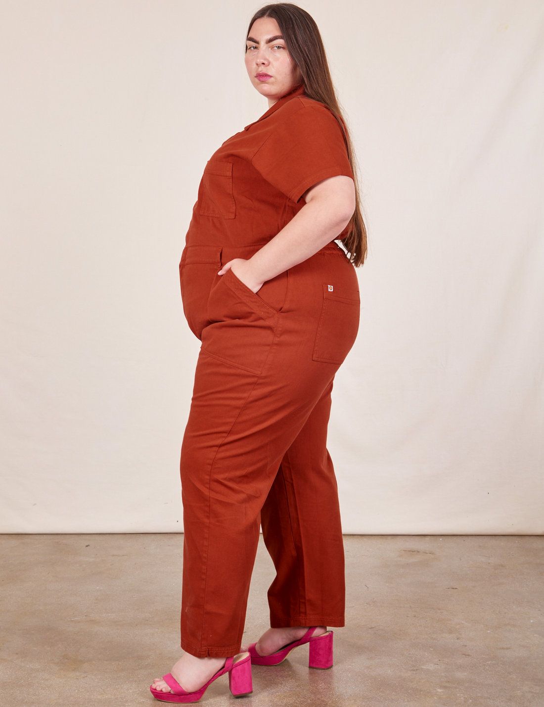 Side view of Short Sleeve Jumpsuit in Paprika worn by Marielena