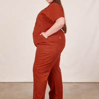 Side view of Short Sleeve Jumpsuit in Paprika worn by Marielena