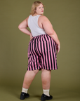 Angled back view of Longline Work Shorts in Bubblegum Pink on Juliet
