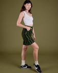 Side view of Longline Work Shorts in Evergreen and Cropped Tank in Vintage Tee White