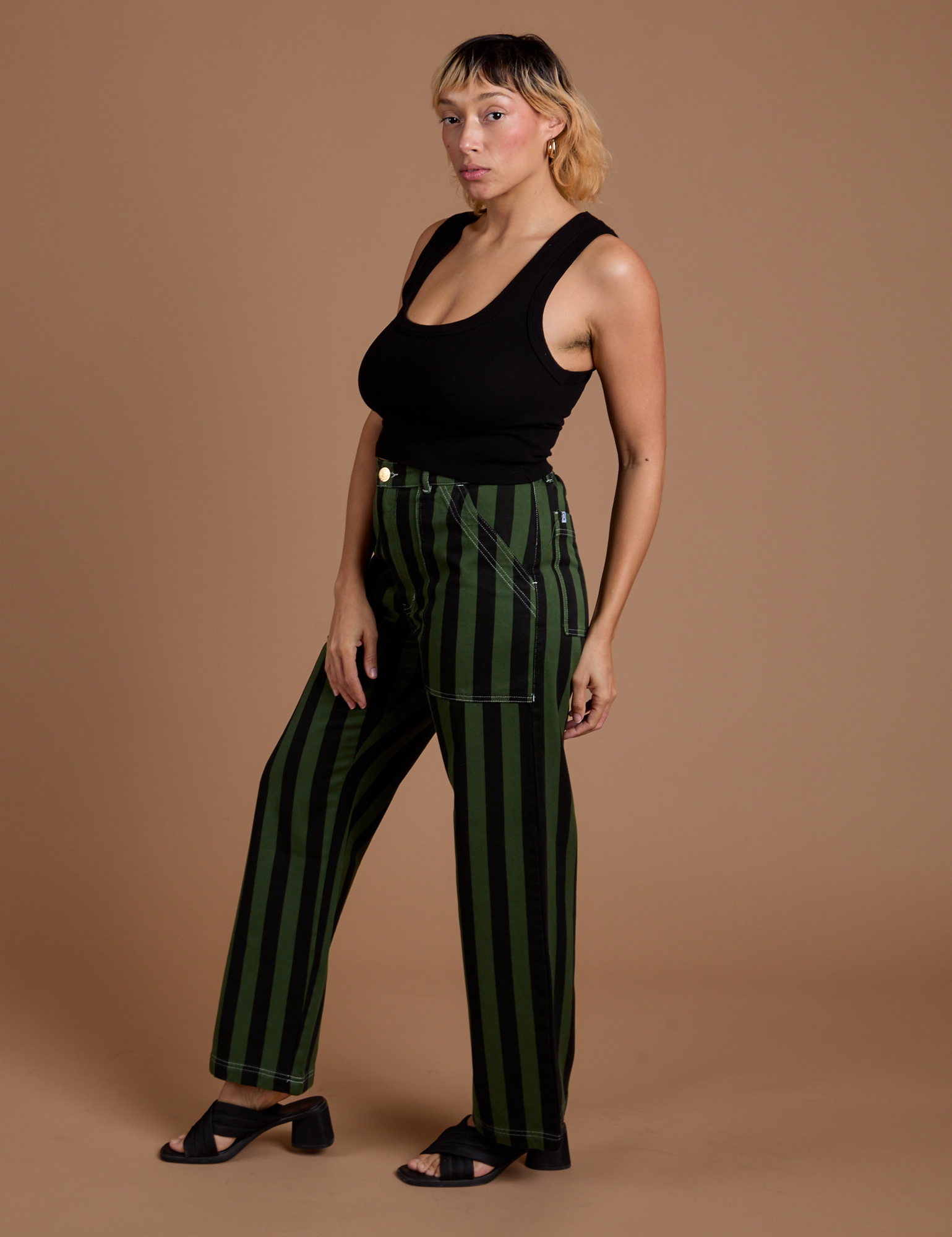 Side view of Black Stripe Work Pants in Evergreen on Tiara