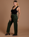 Side view of Black Stripe Work Pants in Evergreen on Tiara