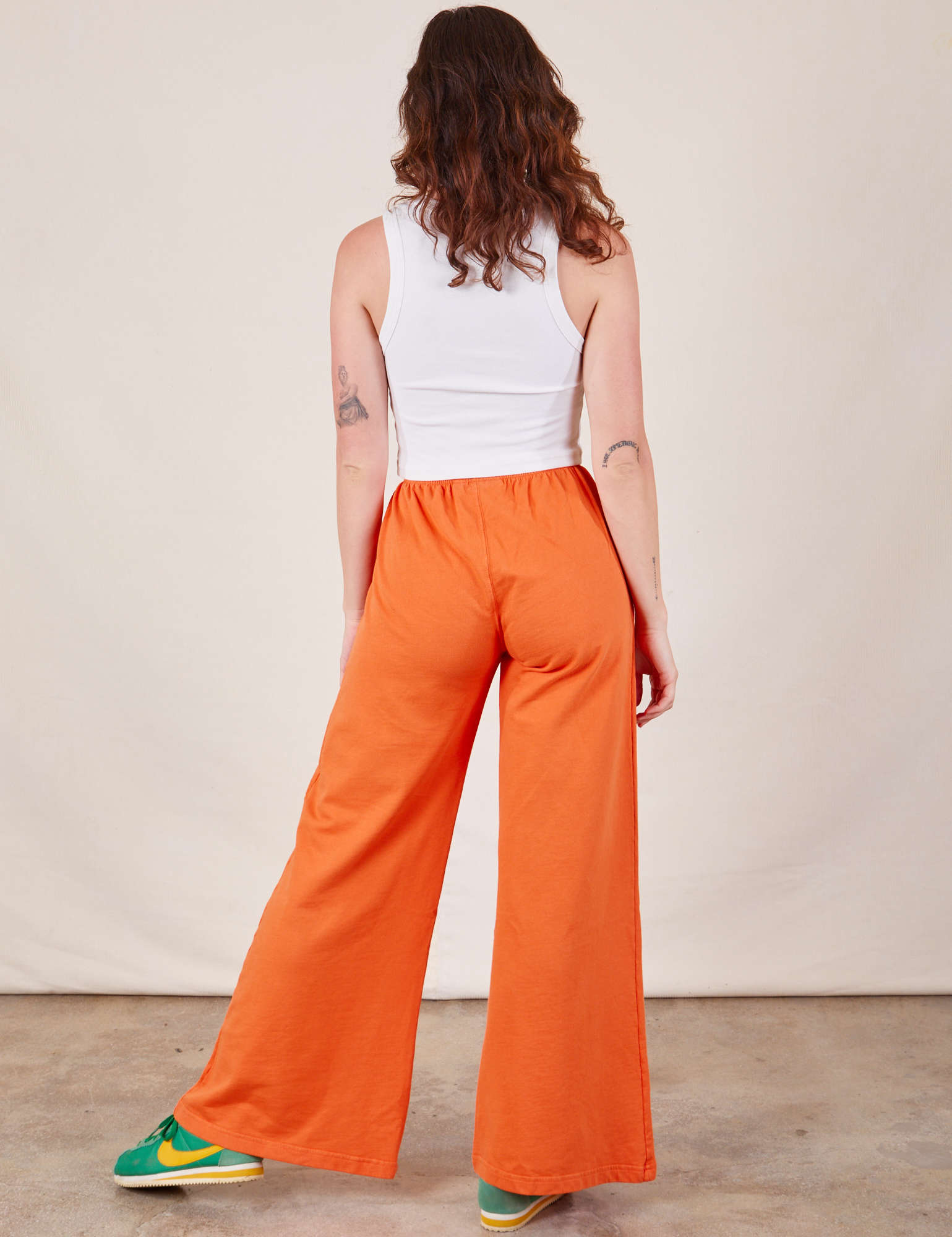 Wide Leg Sweat Pants in Sunset Orange back view on Alex