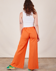 Wide Leg Sweat Pants in Sunset Orange back view on Alex