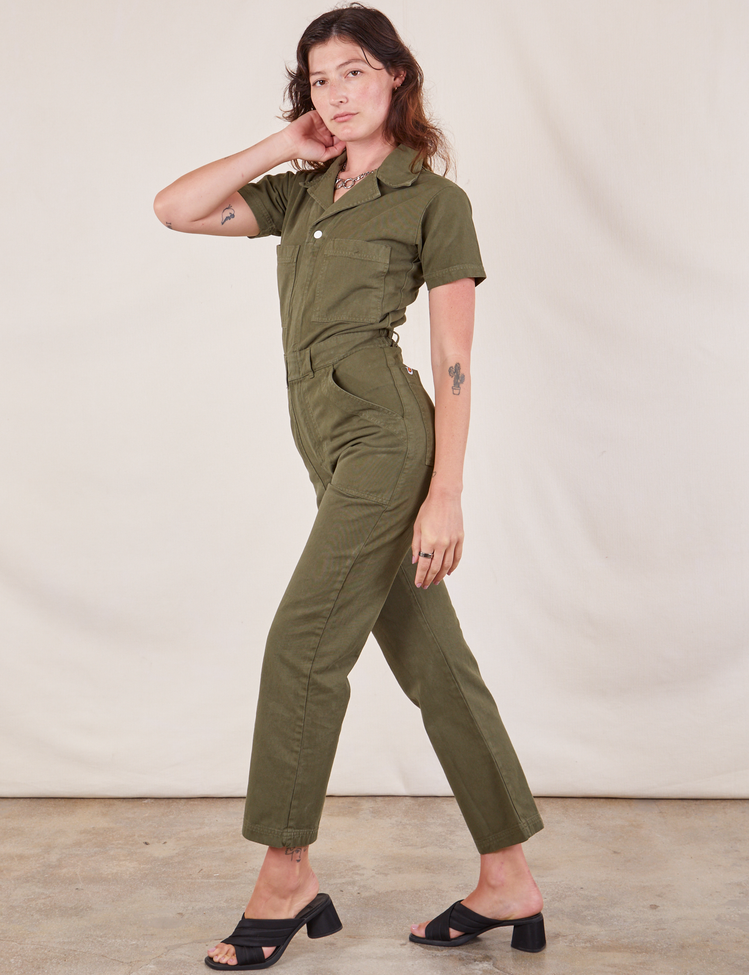 Short Sleeve Jumpsuit in Surplus Green side view on Alex