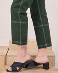 Carpenter Jeans in Swamp Green side pant leg close up on Alex