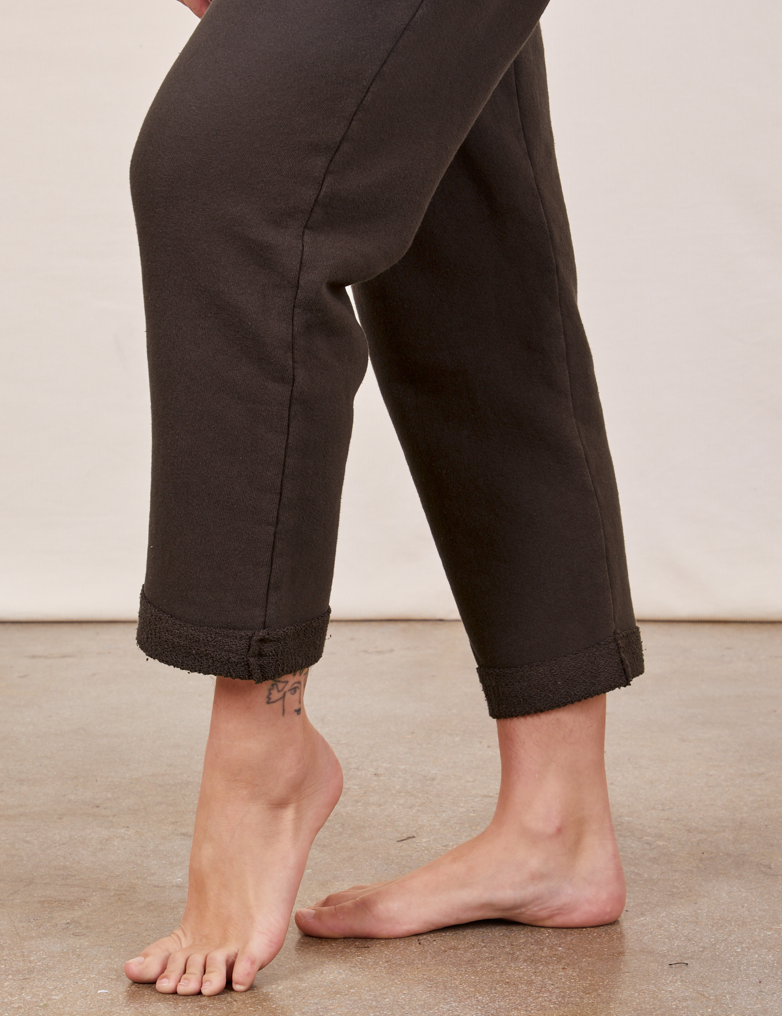 Cropped Rolled Cuff Sweatpants in Espresso Brown pant leg side view close up on Alex