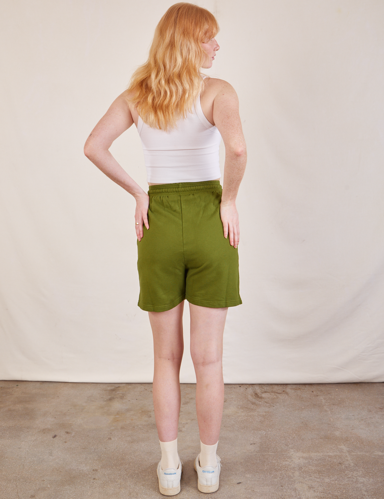 Back view of Lightweight Sweat Shorts in Summer Olive and Cropped Tank in vintage tee off-white on Margaret