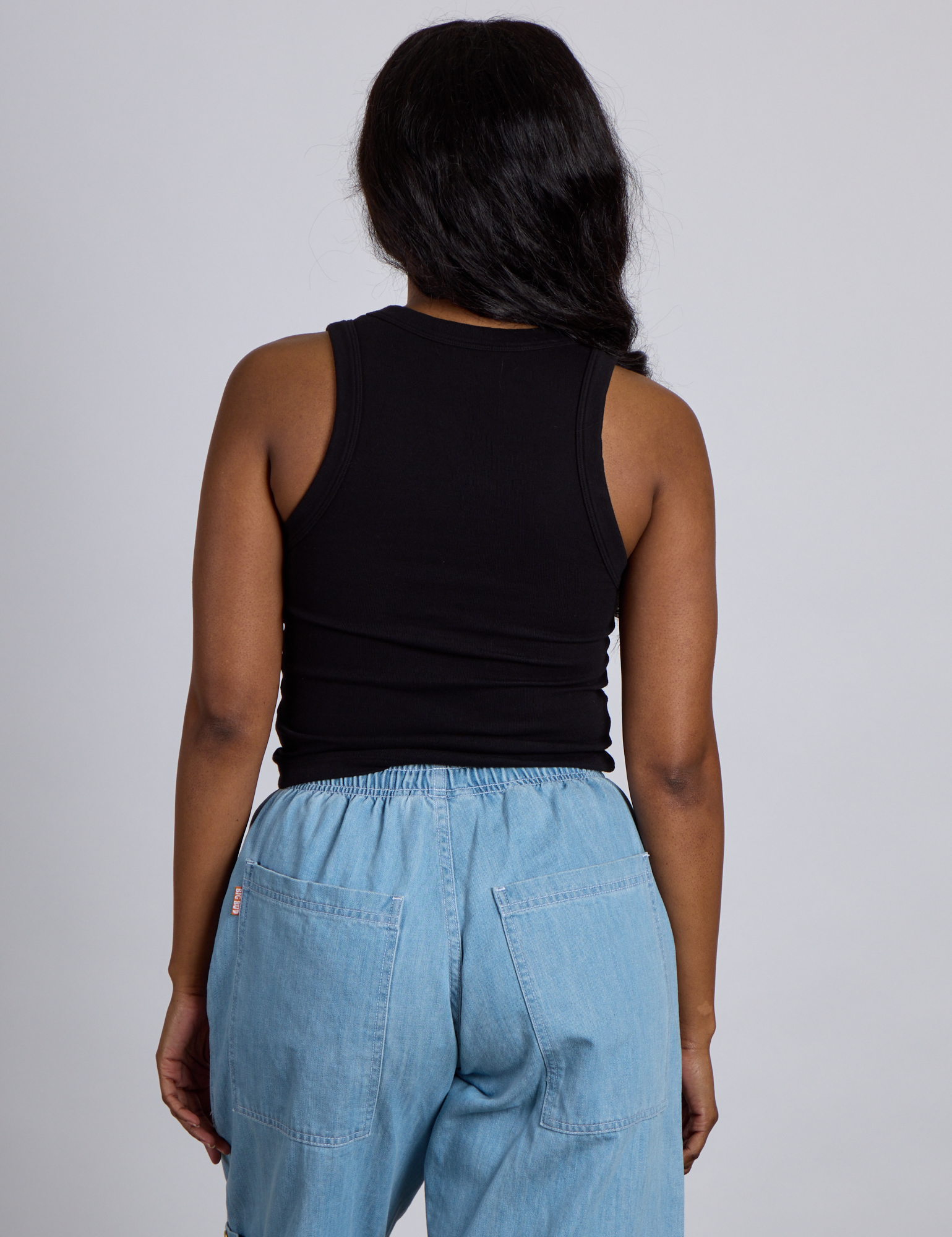 Back view of The Tank Top in Basic Black on Kandia
