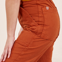 Side view close up of Work Pants in Burnt Terracotta on Soraya