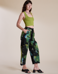 Side view of Magic Waters Drop Pocket Pants in Green Pool and gross green Cropped Tank on Alex