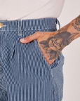 Front pocket close up of Denim Trouser Jeans in Railroad Stripe. Jesse has their hand in the pocket. 