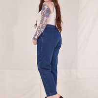 Side view of Denim Trouser Jeans in Dark Wash and vintage off-white Tank Top worn by Sydney