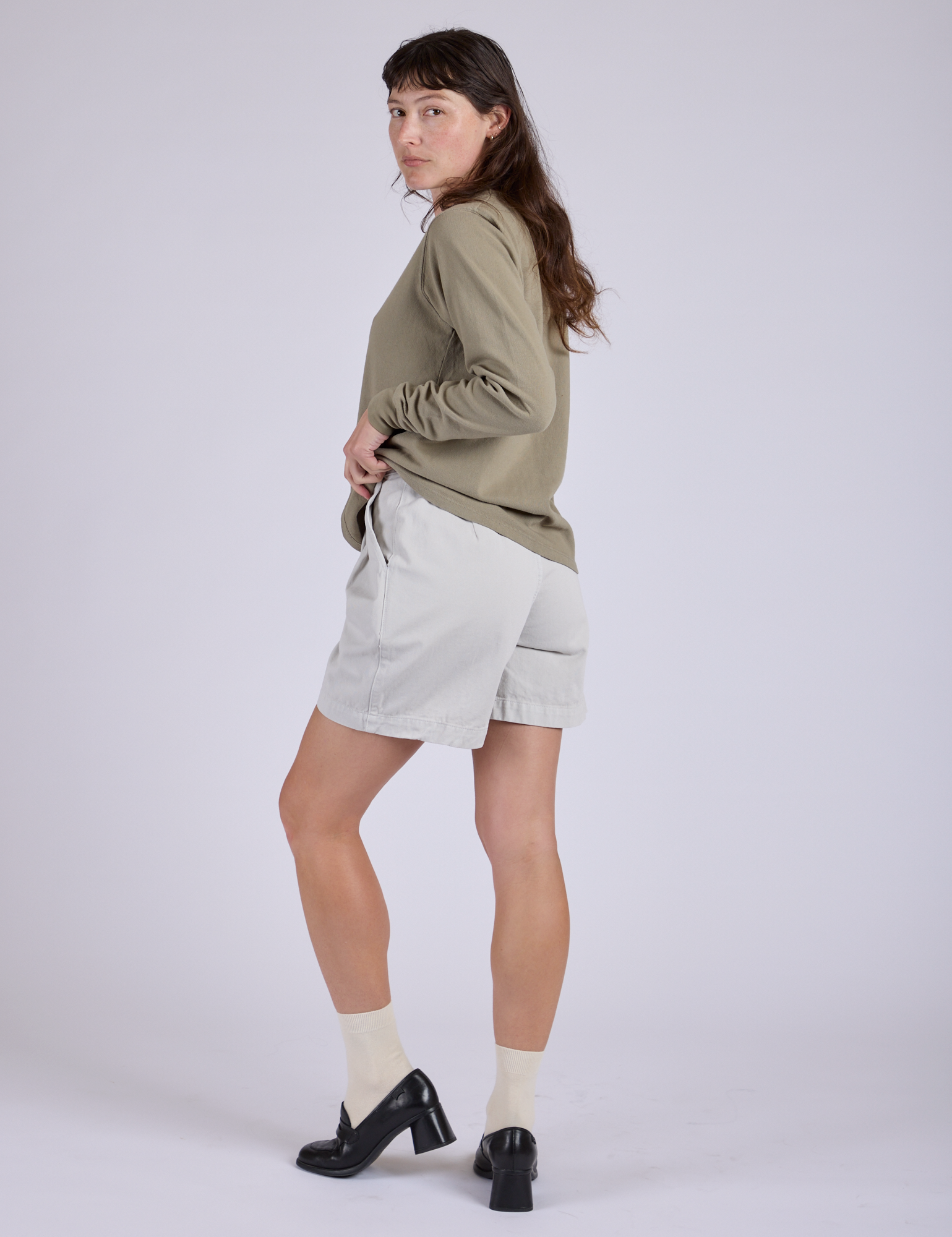 Pleated Trouser Shorts in Dishwater White angled back view on Alex