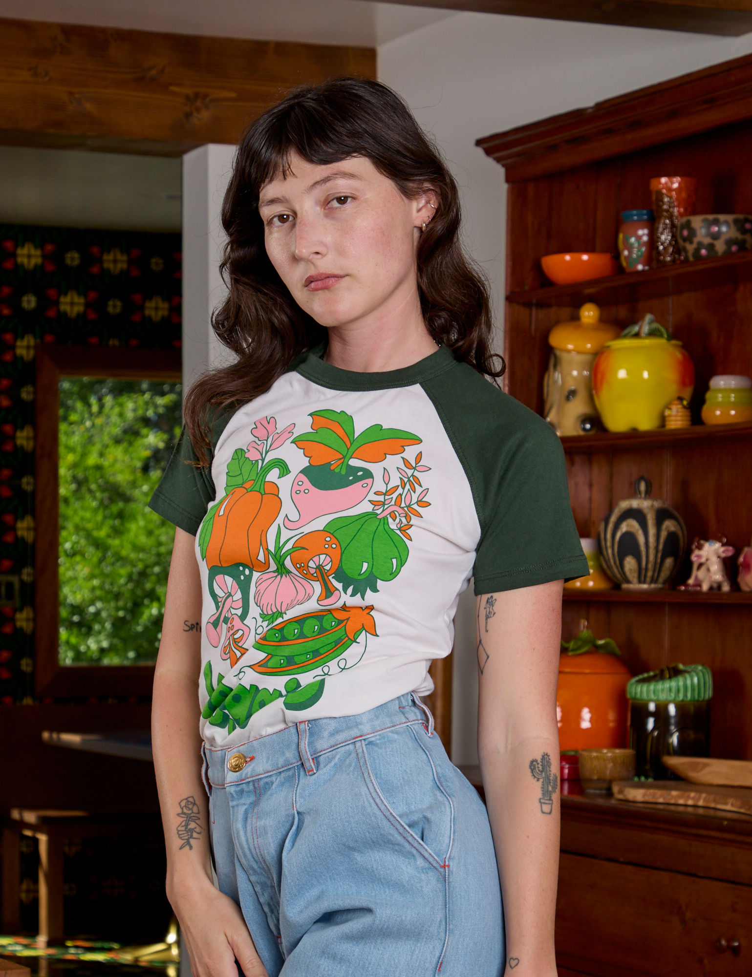 Angled front view of Short Sleeve Raglan Tee in Veggies on Alex