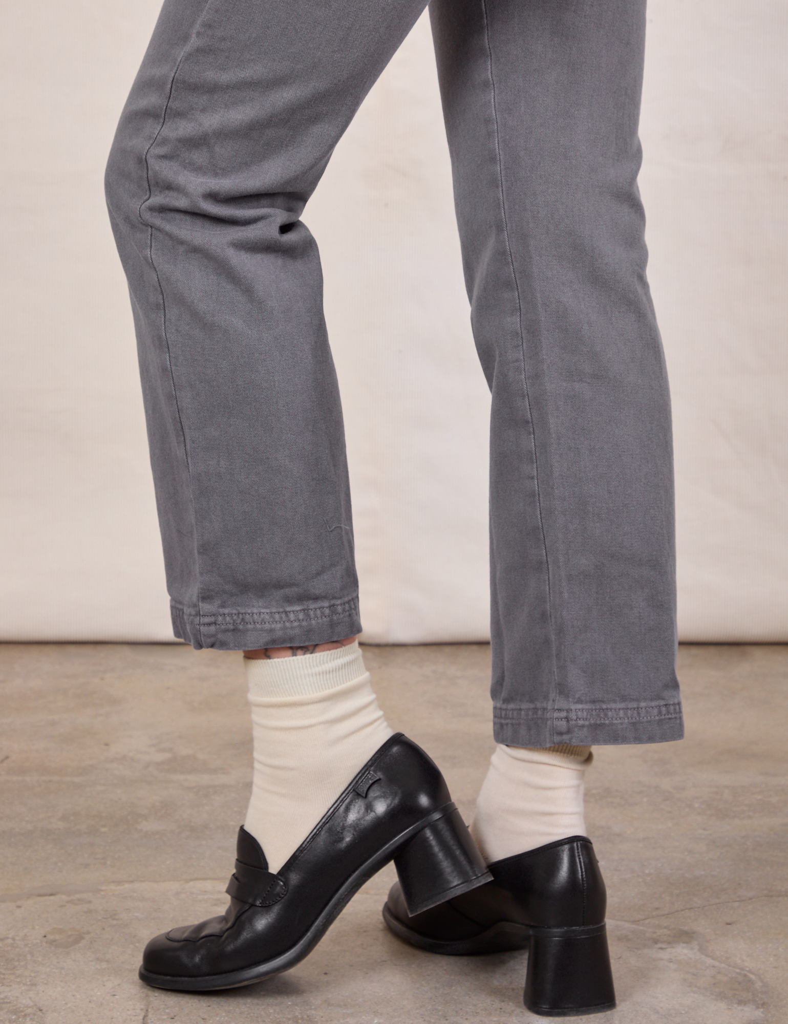 Short Sleeve Jumpsuit in Washed Grey pant leg close up on Alex