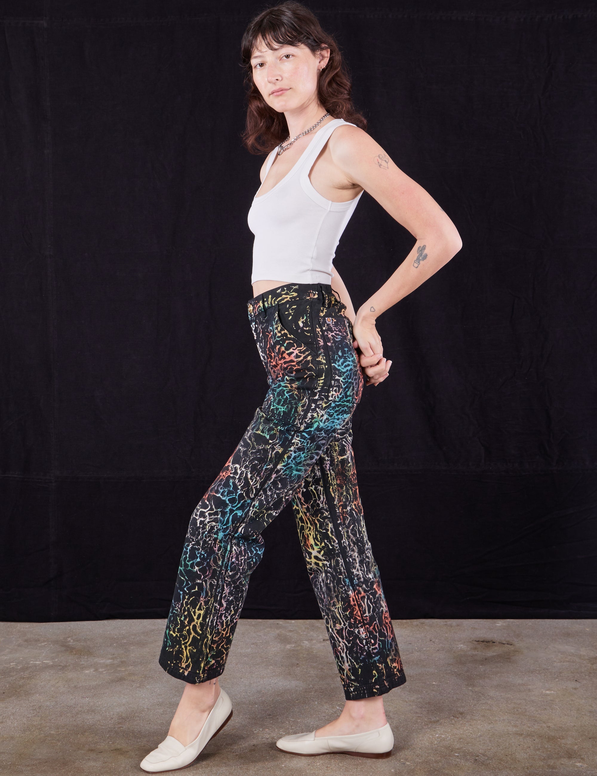 Side view of Wavy Dye Work Pants and vintage off-white Cropped Tank Top on Alex