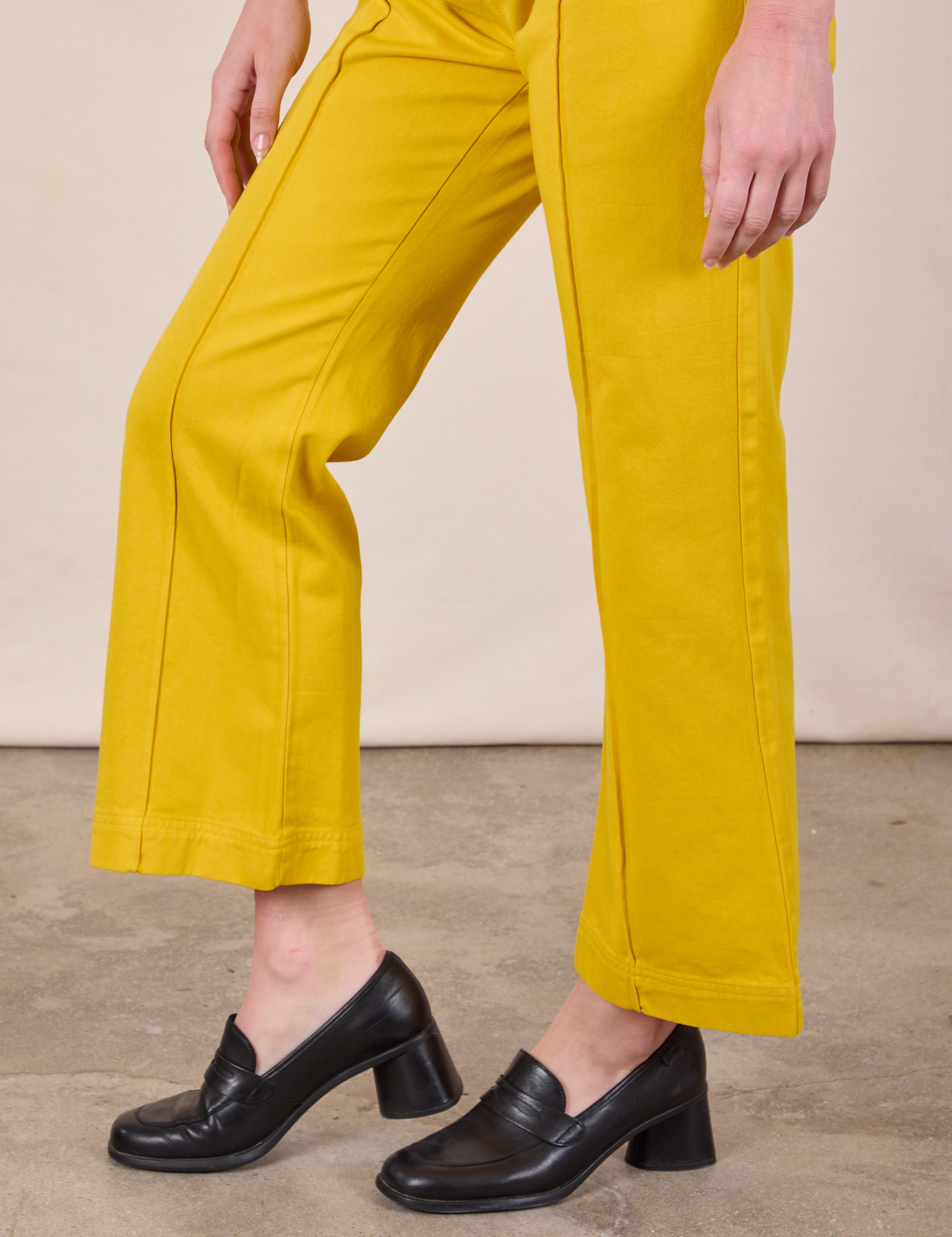 Western Pants in Golden Yellow pant leg close up on Alex