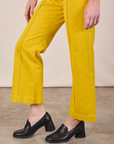 Western Pants in Golden Yellow pant leg close up on Alex