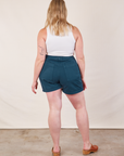 Back view of Western Shorts in Lagoon and Cropped Tank in vintage tee off-white worn by Lish