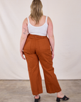 Back view of Western Pants in Burnt Terracotta and Cropped Cami in Vintage Tee Off-White worn by Lish