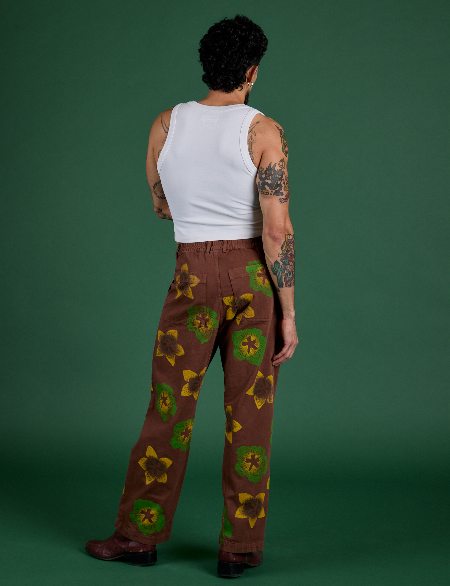 Back view of Floral Painted Work Pants in Brown and Cropped Tank in Vintage Tee White on Jesse