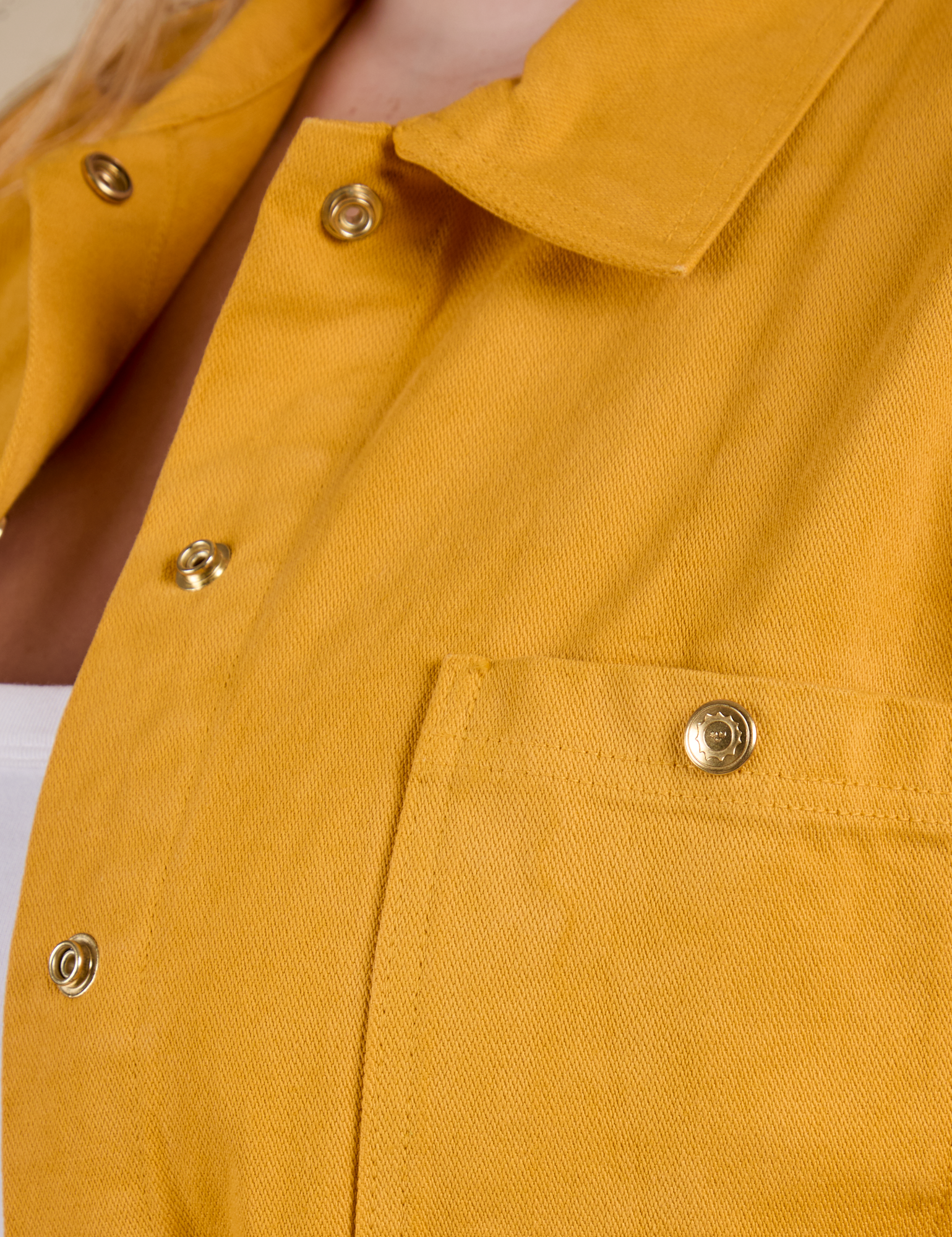 Close up of Denim Work Jacket in Mustard Yellow