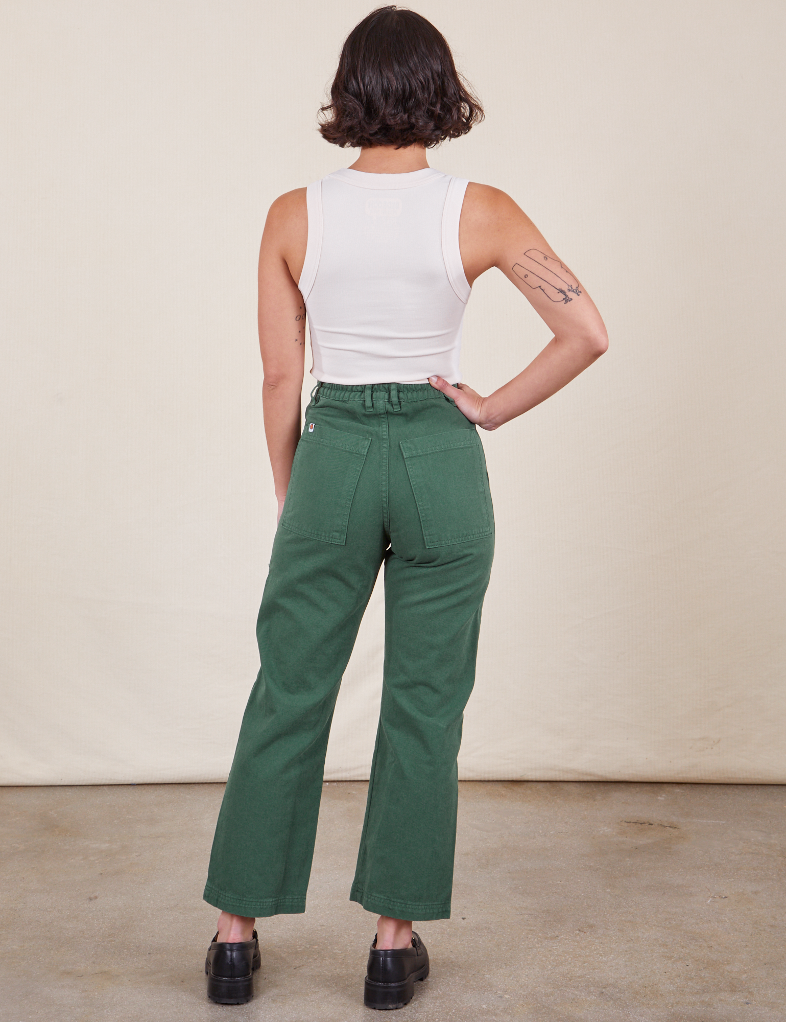 Work Pants in Dark Emerald Green back view on Soraya wearing vintage off-white Tank Top