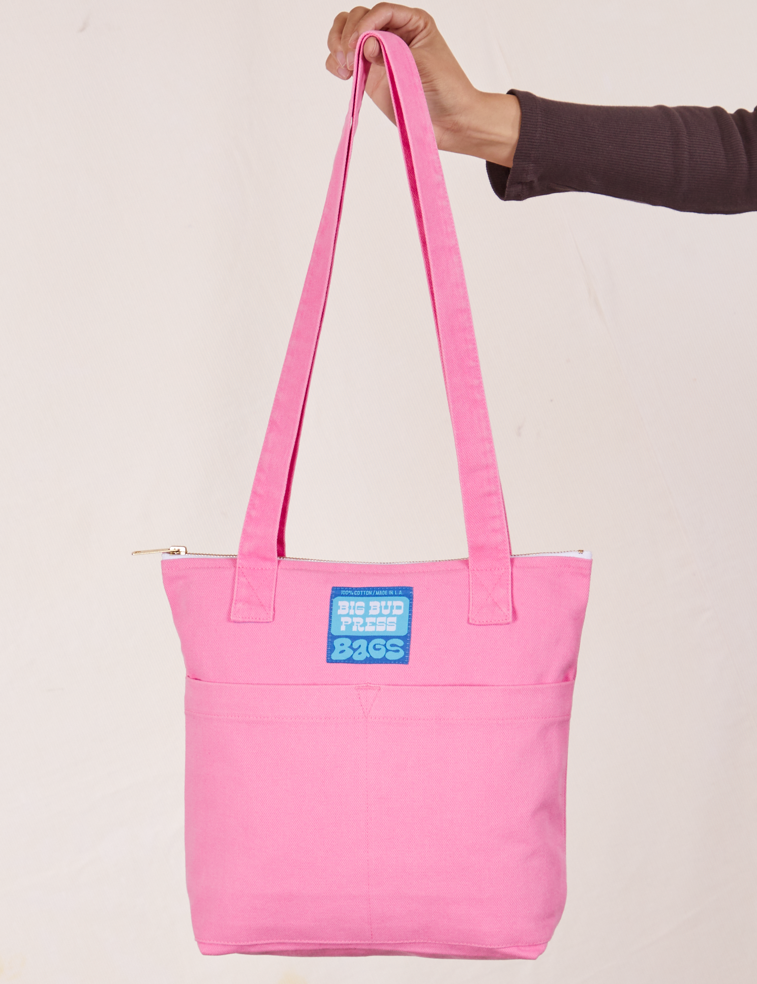 Over-Shoulder Zip Mini Tote in Bubblegum Pink held by model