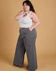 Side view of Heritage Wide Leg Trousers in Washed Grey and Cropped Tank in Vintage Tee White on Ashley