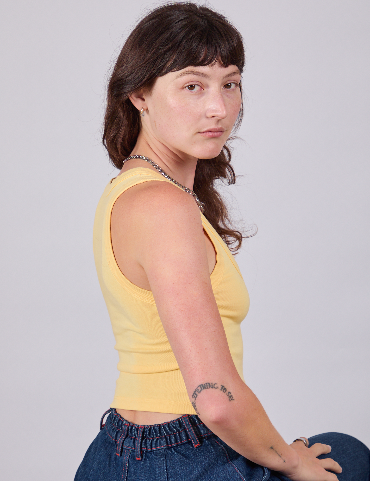 Side view of Cropped Tank Top in Butter Yellow on Alex