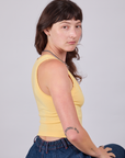 Side view of Cropped Tank Top in Butter Yellow on Alex