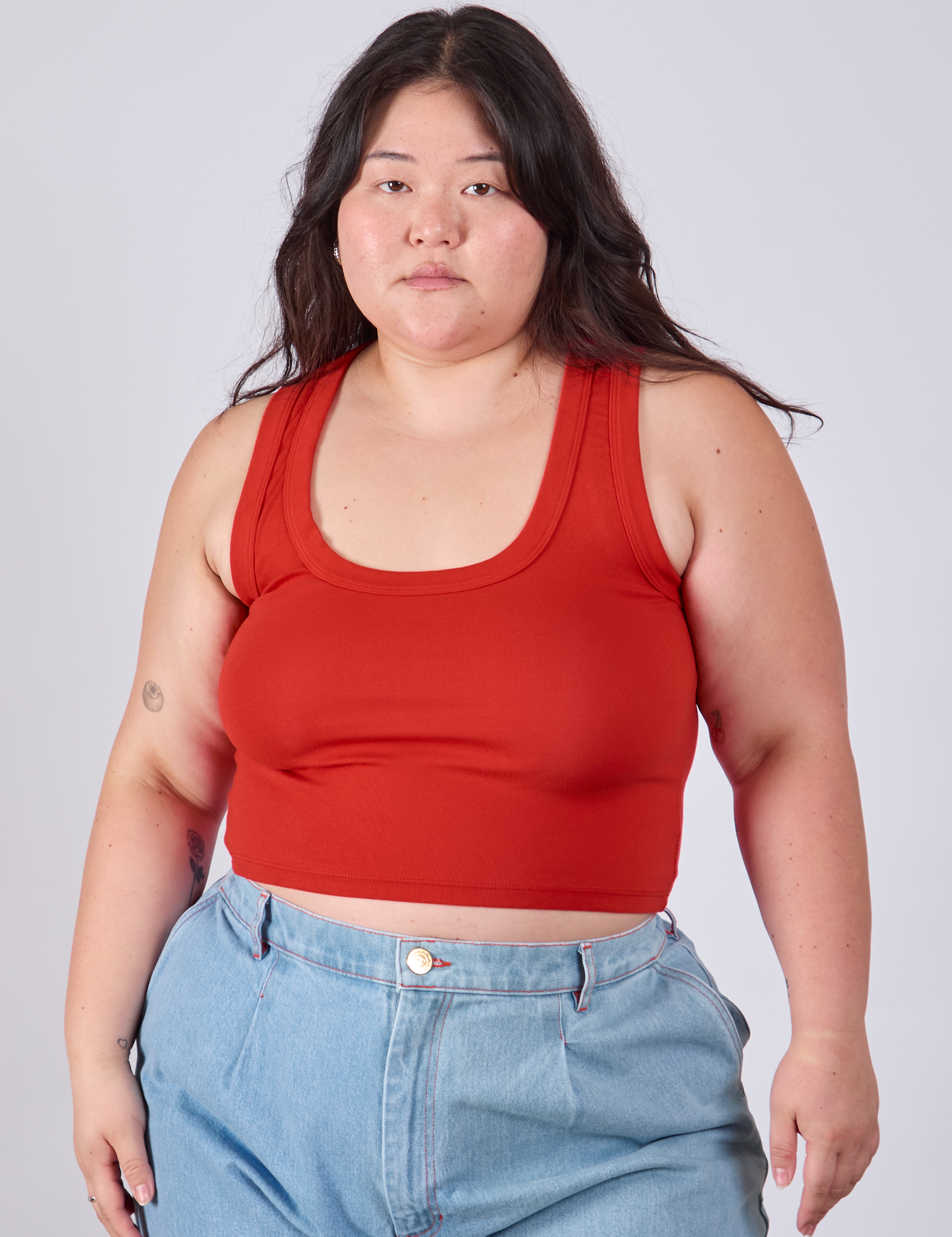 Ashley is 5&#39;7&quot; and wearing L Cropped Tank Top in Mustang Red