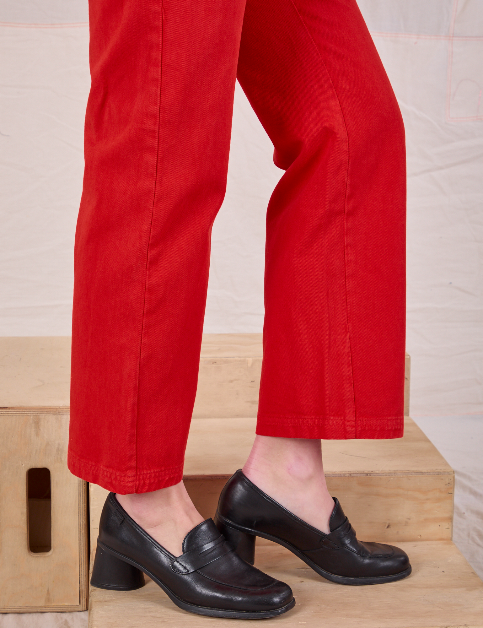 Mid-Rise Work Pants in Mustang Red pant leg close up on Alex