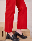 Mid-Rise Work Pants in Mustang Red pant leg close up on Alex