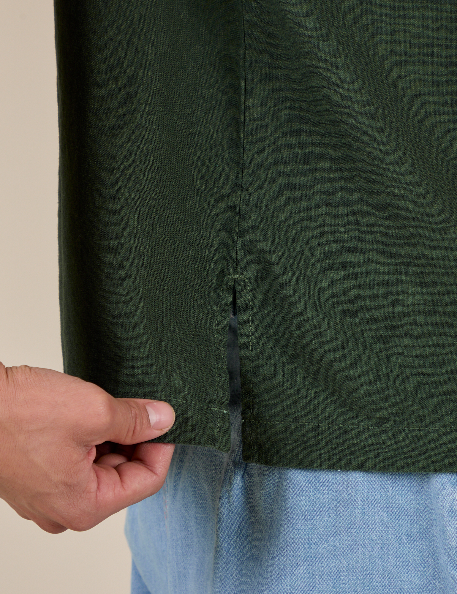 Close up side vent of Pantry Button-Up in Swamp Green on Anthony