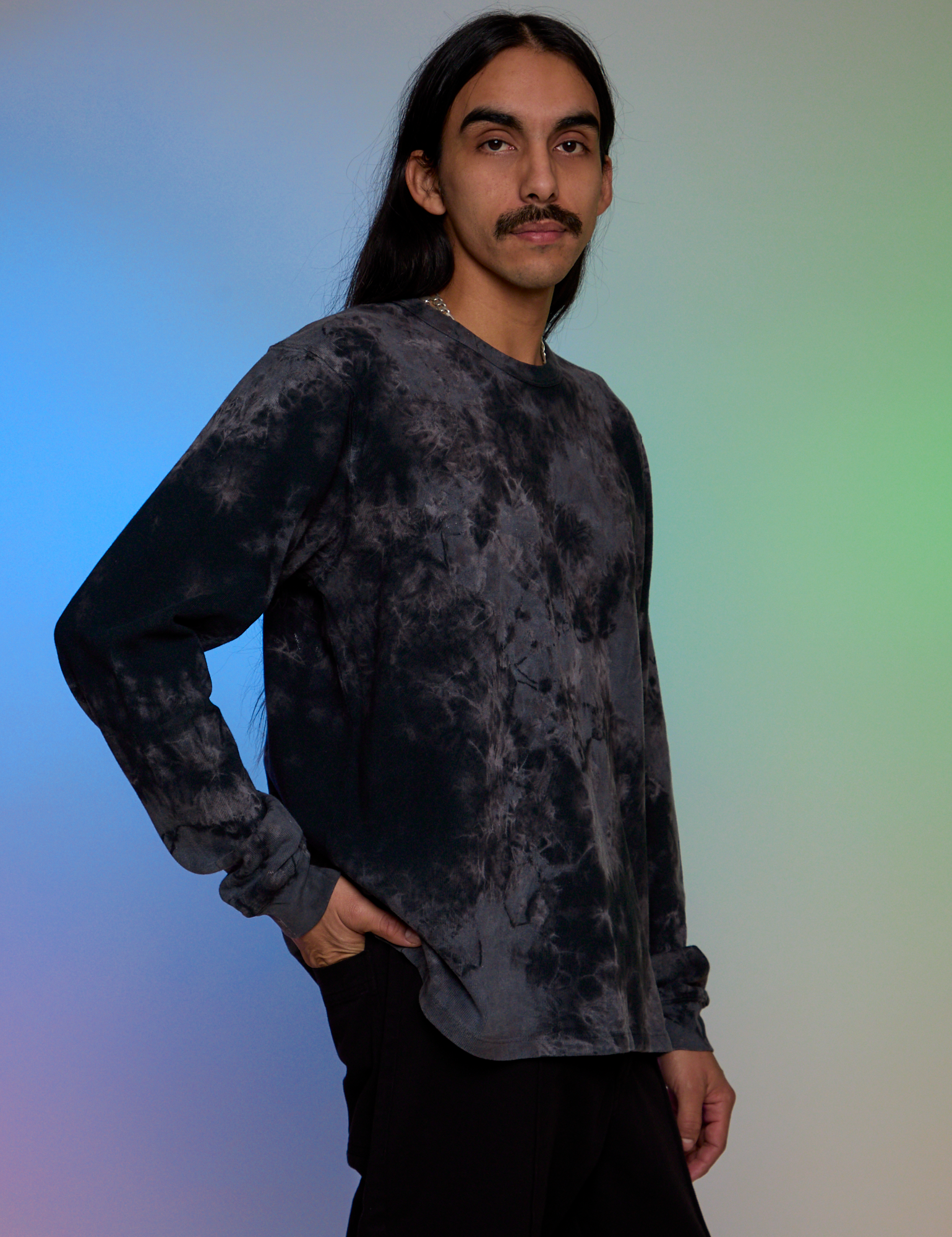 Angled front view of Magic Waters Long Sleeve Burly Tee in Black on Anthony